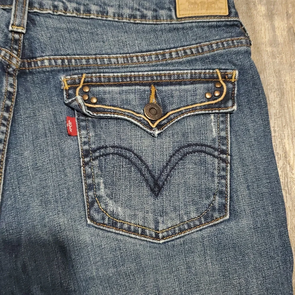 Levi 515 boot cut womens size 12M Blue Jeans Casual Medium Wash Distressed - Picture 9 of 12